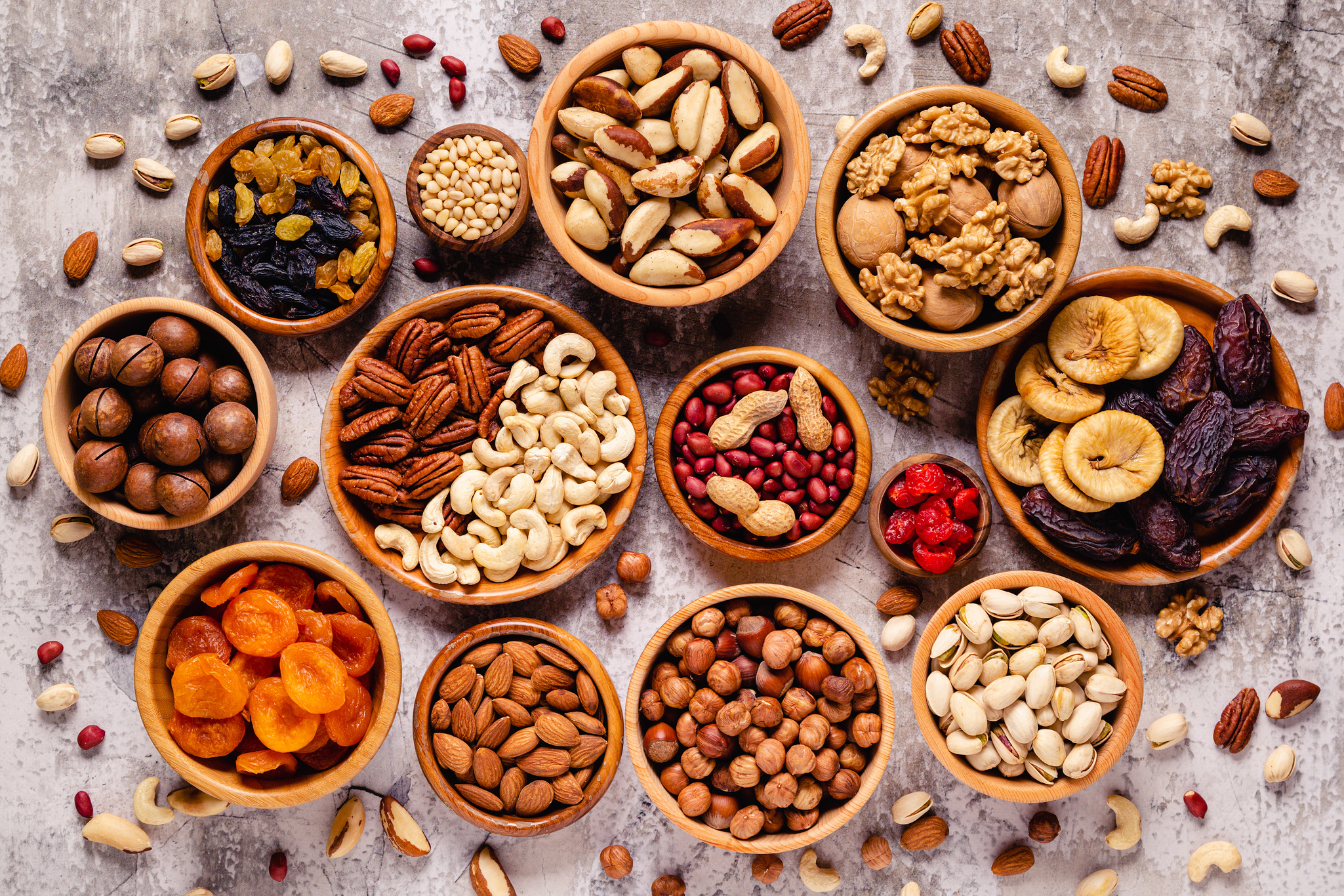 Various Nuts and dried fruits in wooden bowls